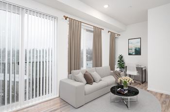 A living room with a couch and a table